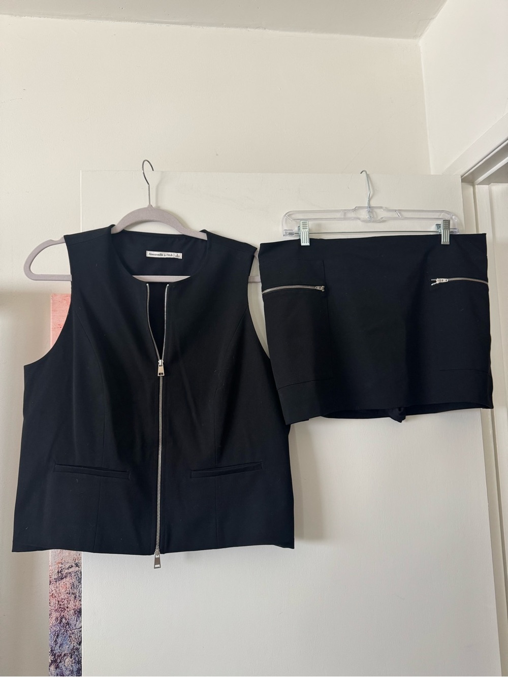 Sleeveless Black Zip-Front Vest and Skort Set